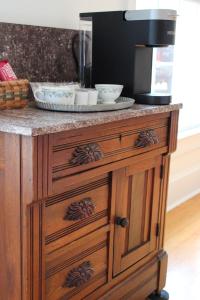 a counter with a coffee maker on top of it at The Emory House in Emory