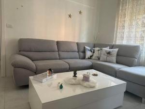 a living room with a couch and a coffee table at Pash apartment in Pero
