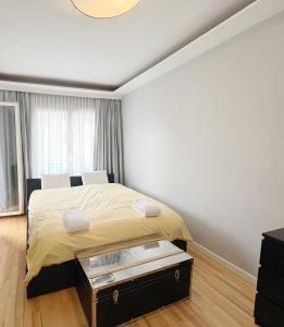 a bedroom with a large bed in a room at Prime Comfort Apartment with Balcony & Free Parking in Berlin