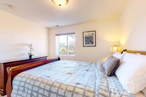 a bedroom with a bed and a window at La Cana Street Leisure - Main Home & In-Law suite in Coupeville
