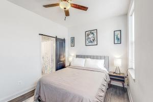 a bedroom with a bed and a ceiling fan at Brixton Manor in Baltimore