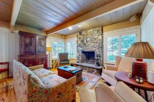 a living room with a couch and a fireplace at Villager Retreat in Sun Valley