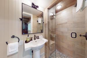 a bathroom with a sink and a shower at Villager Retreat in Sun Valley +13 photos