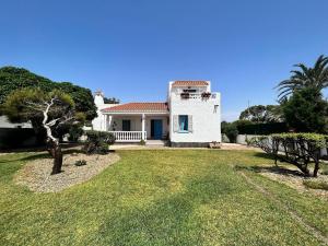 a white house with a yard with trees at Spacious holiday home in almeria near beach in Almería