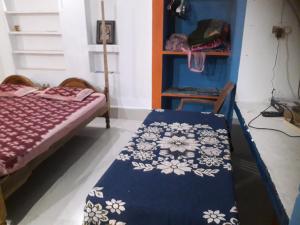 Letto o letti in una camera di Sudha Kutir Puri