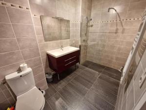a bathroom with a toilet and a sink and a shower at Confort 2 pièces pour 4 pers, Châtelaillon-Plage, parking - FR-1-706-4 in Châtelaillon-Plage