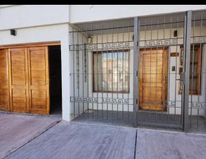 a building with three doors on the side of it at Casa nueva centrica in San Rafael