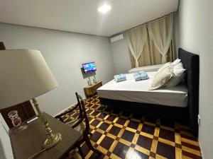 Postel nebo postele na pokoji v ubytování Hotel Dom Marechal neoclássico