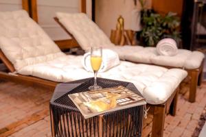 a glass of champagne on a table in a living room at El Recinto Luxury Hotel in San Miguel de Allende