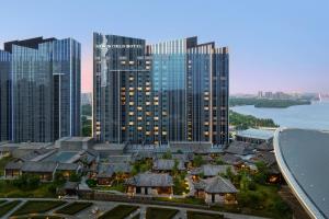 an aerial view of a city with tall buildings at New World Shenyang Hotel in Shenyang