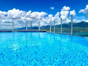 a swimming pool with a view of the mountains at Kimpton - Armory Hotel Bozeman, an IHG Hotel in Bozeman