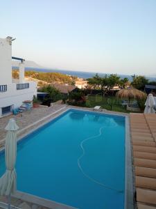 a swimming pool in a villa with a view at Efi in Kato Alepochori