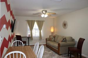 a living room with a couch and a table at Hidden Ruby-Apartment with Kitchen and Laundry in Lakeland