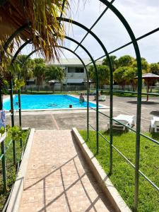 a view of a swimming pool from a resort at Appartement Idéal in Petit-Bourg +5 photos
