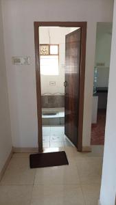 an open door to a bathroom with a shower at SRI SANKARA VILLAS -- Aditya Heritage in Kumbakonam +21 photos