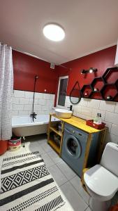 a bathroom with a washing machine and a tub at Дом в горах Уютный дом с потрясающим видом и огромной террасой in Besqaynar +39 photos