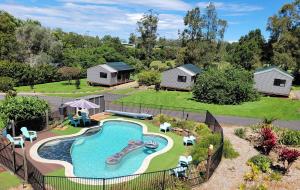 an aerial view of a backyard with a swimming pool at Southern Sky Glamping in Mount Tamborine