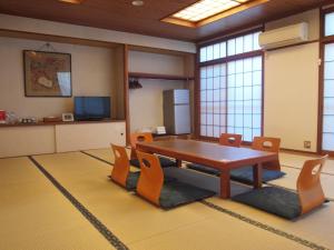 a conference room with a table and chairs at Senkei Plaza in Hakone