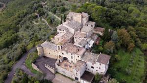 an aerial view of a large castle in a forest at Maison Rosina con ampia vista in borgo del 1400 in Marsciano