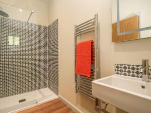 a bathroom with a sink and a shower at Church Farm Barn in Saxmundham +42 photos