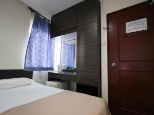 Un ou plusieurs lits dans un hébergement de l'établissement Amrise Hotel