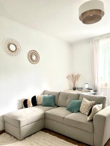 a living room with a couch in a room at Beethoven Apartman in Budapest