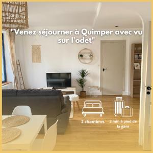 a living room with a couch and a table at Quimper: T3 avec vue cathédrale proche gare in Quimper