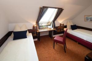 Tempat tidur dalam kamar di Hotel Schlair