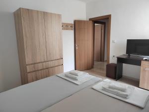 Postel nebo postele na pokoji v ubytování ARIA