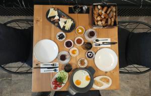 a table topped with plates and bowls of food at Nilus Urla in Urla