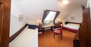 Tempat tidur dalam kamar di Hotel Schlair