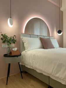 Postel nebo postele na pokoji v ubytování 月月寓室 Luna INN 民宿