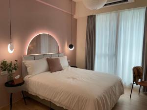 Postel nebo postele na pokoji v ubytování 月月寓室 Luna INN 民宿