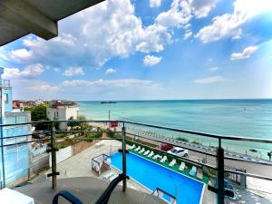 a view of the ocean from the balcony of a condo at Seaside Inn & Suites in Costinesti