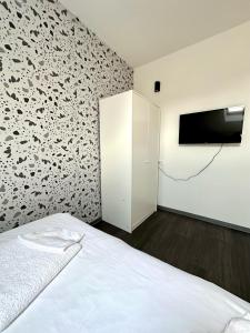 TV a/nebo společenská místnost v ubytování KAPTOL Rooms