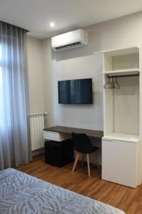 TV a/nebo společenská místnost v ubytování B&B MariLù