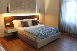 Postel nebo postele na pokoji v ubytování B&B MariLù