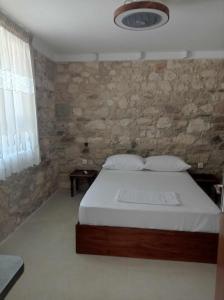 Ένα ή περισσότερα κρεβάτια σε δωμάτιο στο MangoSeaview Home
