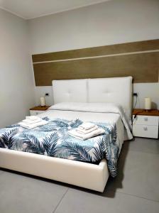Rúm í herbergi á Albergo Piazza Risorgimento