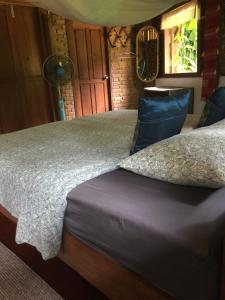 Una cama o camas en una habitación de Sang Tong Huts