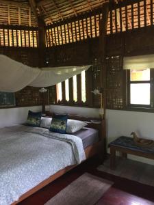 Una cama o camas en una habitación de Sang Tong Huts