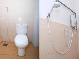 a bathroom with a toilet and a shower at Hotel De'light Villa in Kota Bharu