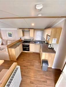 an overhead view of a kitchen in a caravan at Private Lakeside Cabin in St Austell