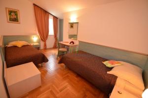 Posteľ alebo postele v izbe v ubytovaní Apartments Materada Residence