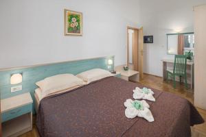 Posteľ alebo postele v izbe v ubytovaní Apartments Materada Residence
