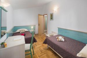 Posteľ alebo postele v izbe v ubytovaní Apartments Materada Residence