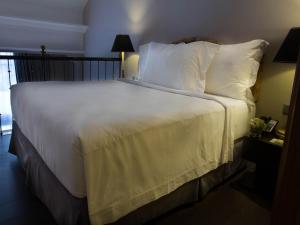 Postel nebo postele na pokoji v ubytování Hotel Gran Mahakam