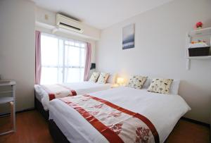 Postel nebo postele na pokoji v ubytování HOTEL AARON通天西 + 37 fotografií