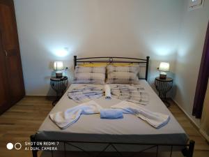 Thalassa Home Comfort tesisinde bir odada yatak veya yataklar