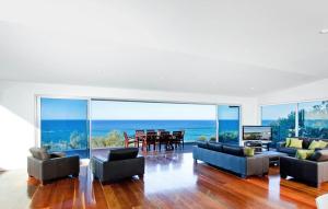 a living room with a view of the ocean at 28 Park Crescent, Sunshine Beach in Noosa Heads